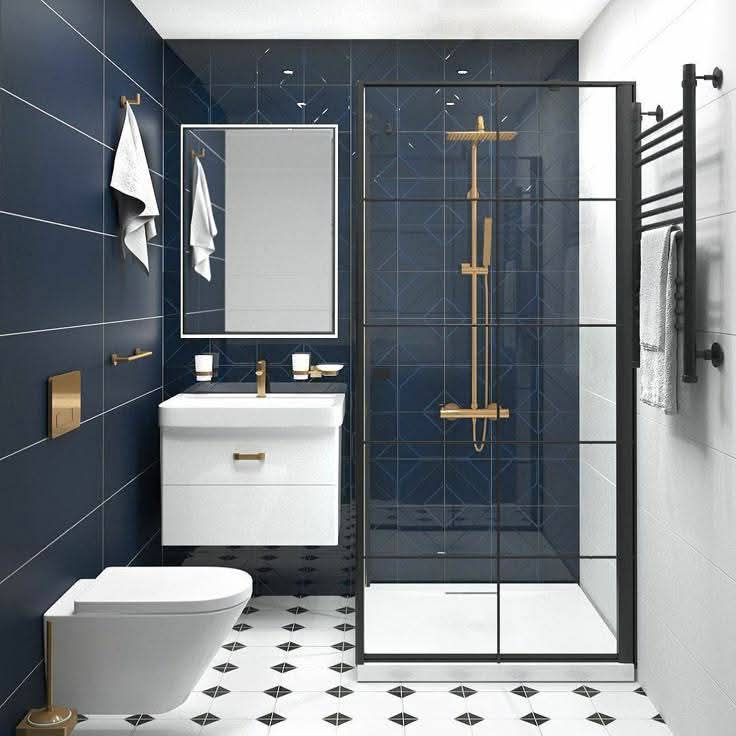 Modern bathroom with seamless shower, blue tiles, white fixtures, black-framed glass, and black-and-white floor.